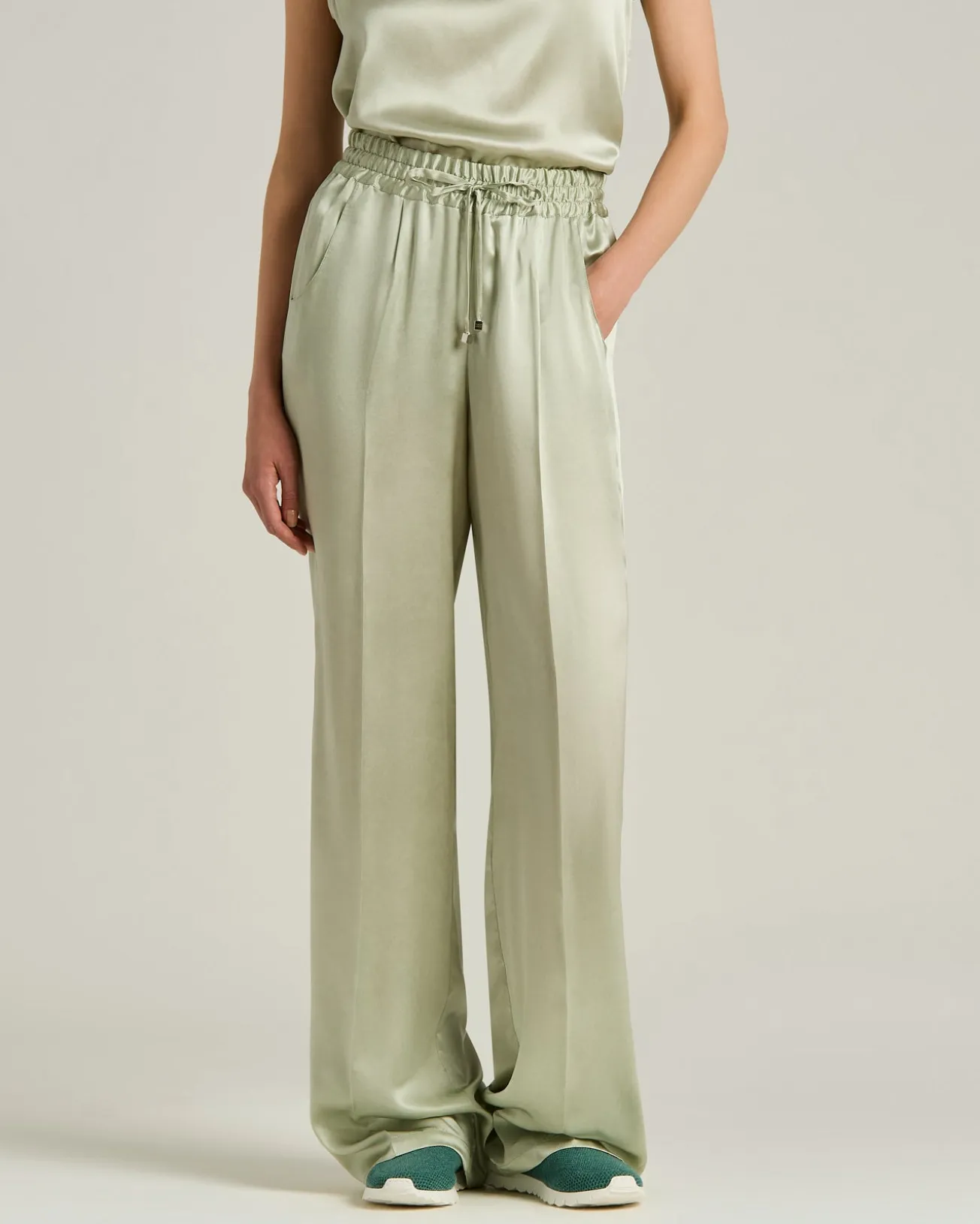 FLUID SATIN TROUSERS IN GREEN SILK